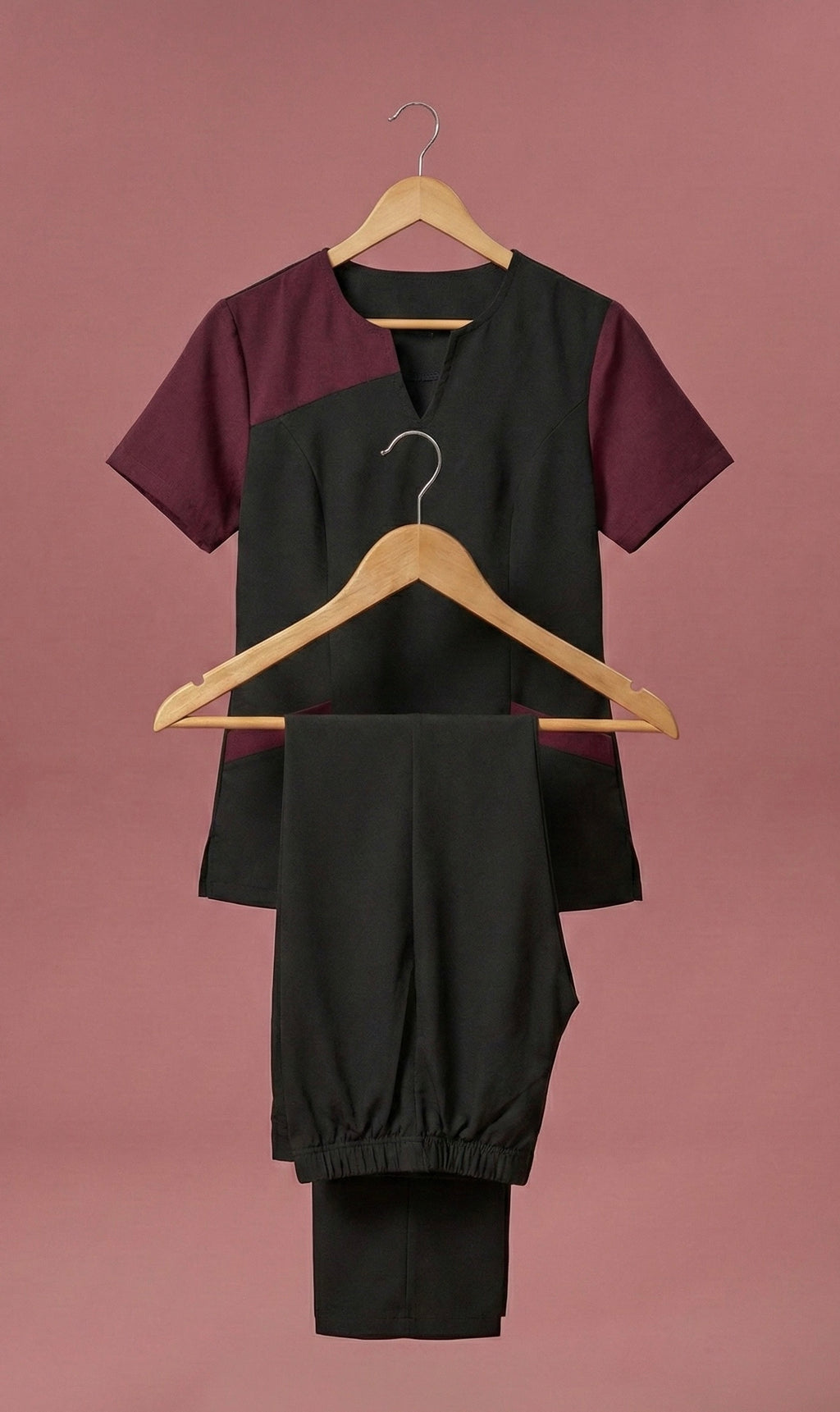 Two clothing items on hangers against a brown background