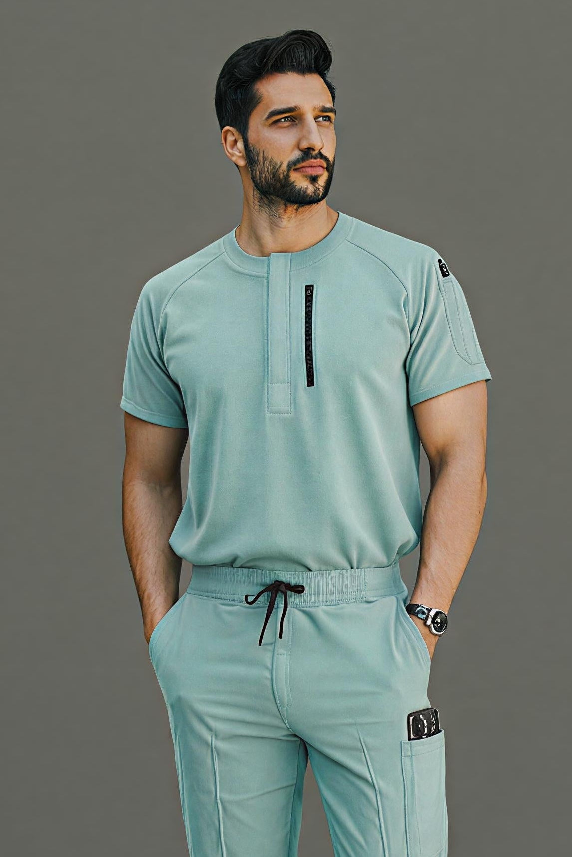 Man wearing a light green outfit with a dark gray background