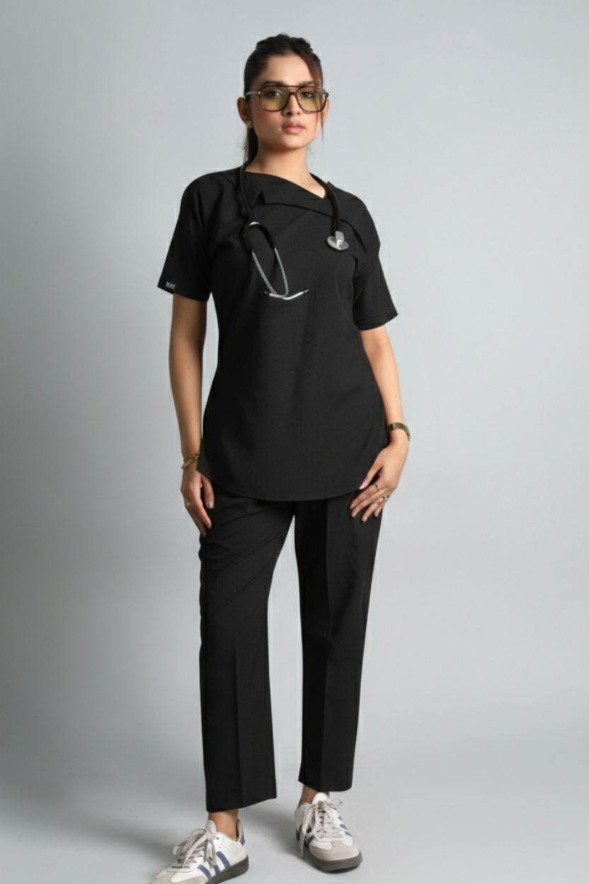 Person wearing a black outfit with a gray background