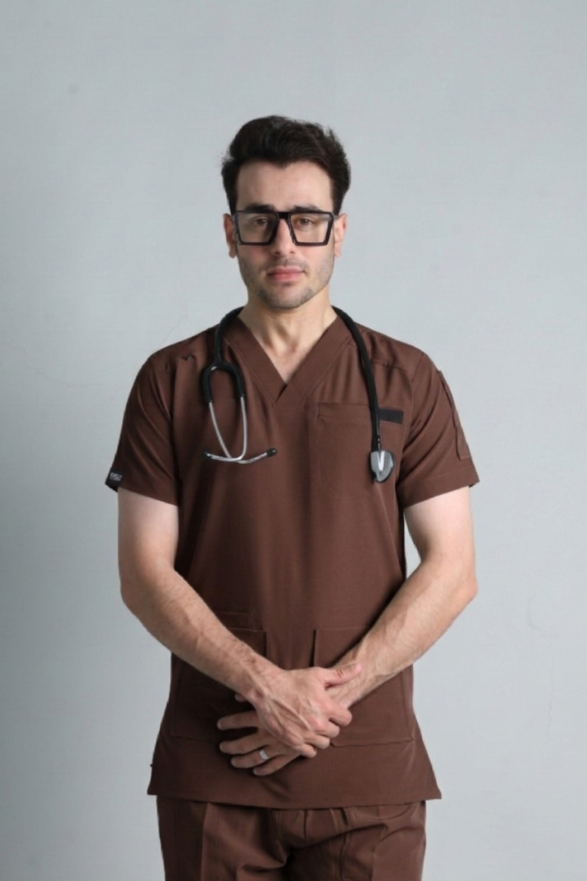 Person wearing brown medical scrubs with a stethoscope on a gray background