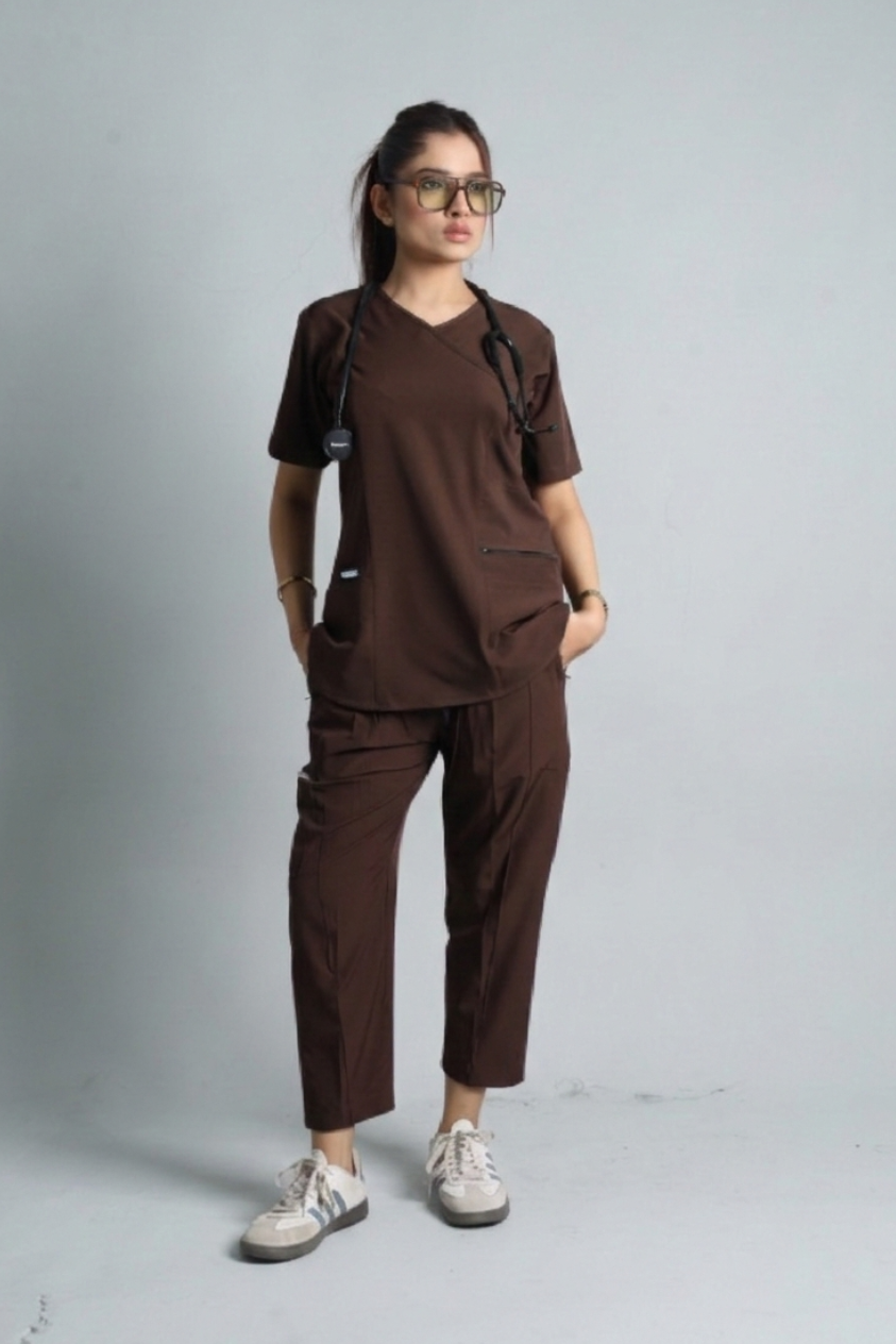 Person wearing a brown outfit with a plain background