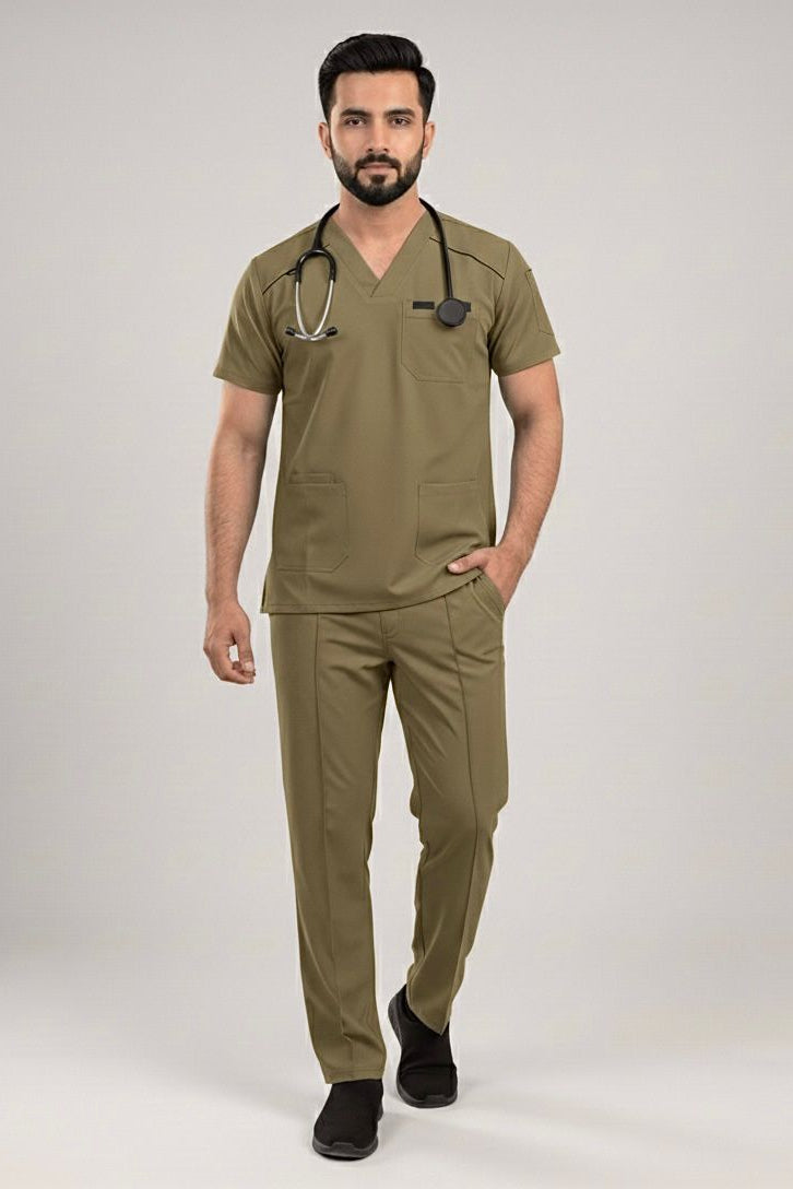 Man wearing olive green medical scrubs with a stethoscope on a light gray background