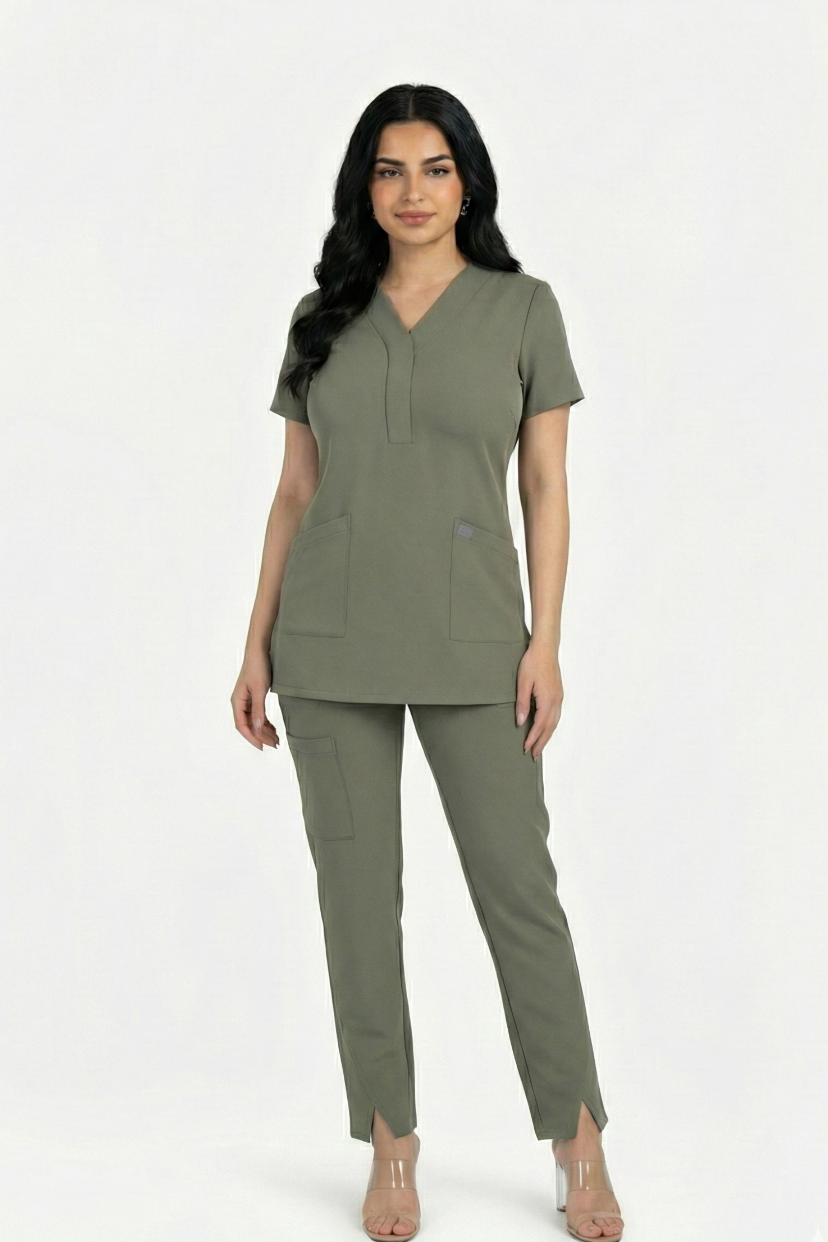 Woman wearing a green scrub set on a white background