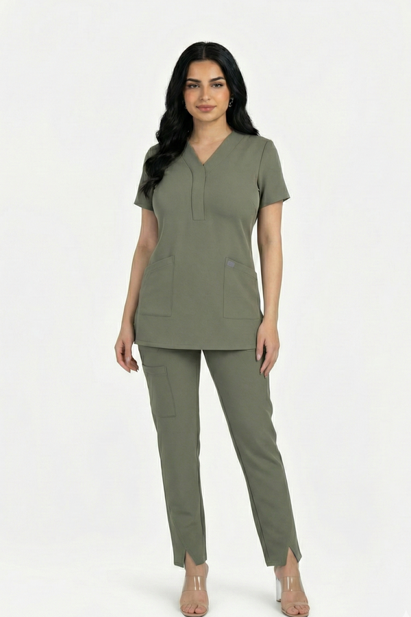 Woman wearing a green scrub set on a white background